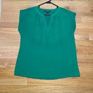 Green sleeveless blouse